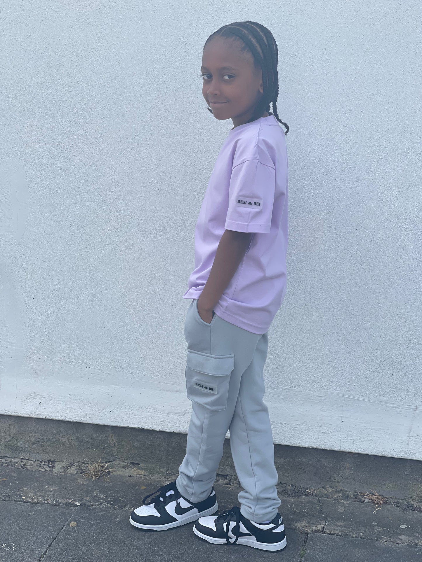 Side view of Boys Grey Cargo Pants with utility pockets and adjustable waistband