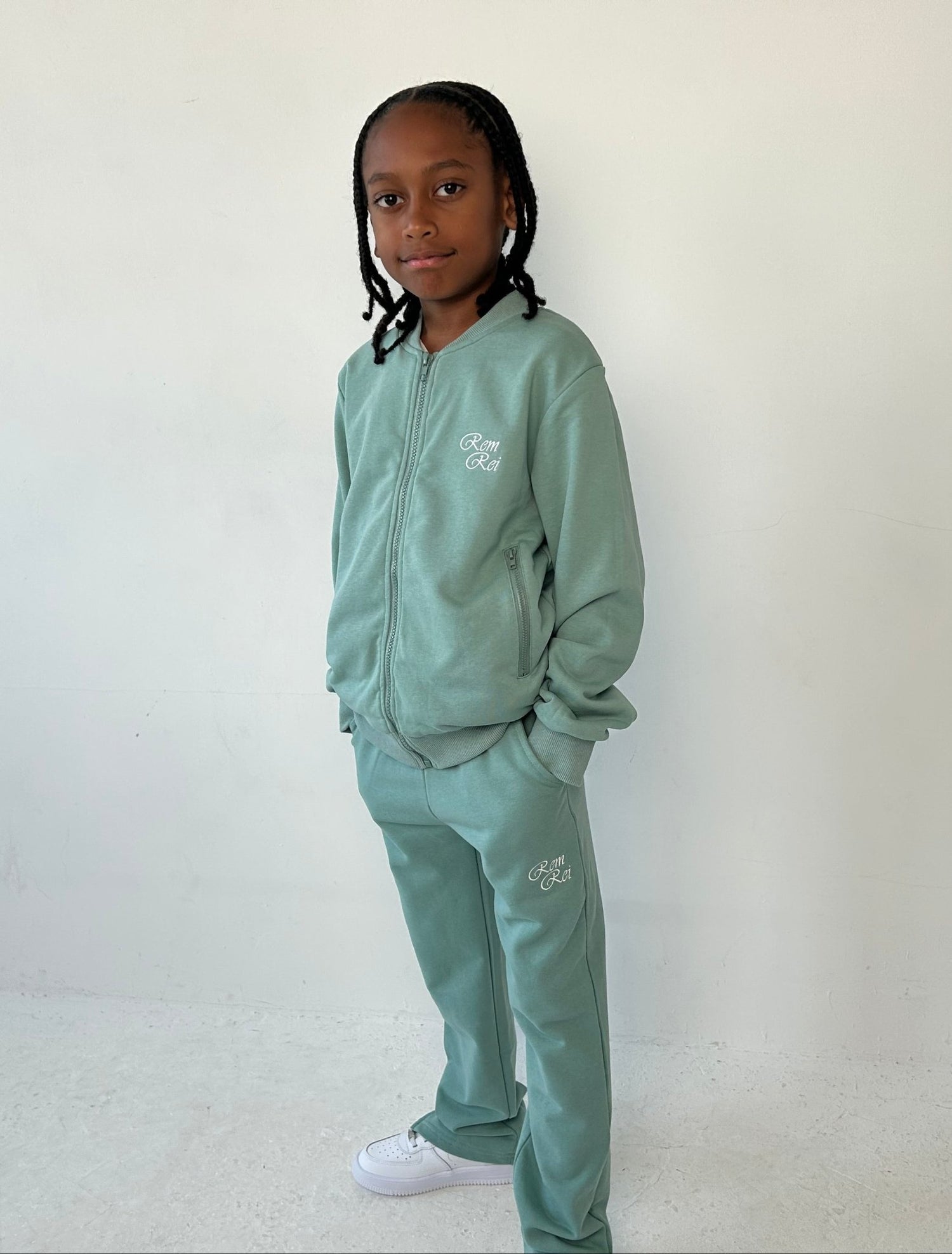 Front view of Boys Lightweight Tracksuit in green, featuring a zip-up jacket and joggers.