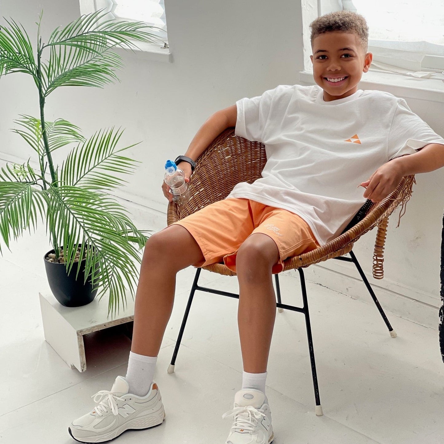 Boys bright orange shorts - holiday outfit - Rem & Rei