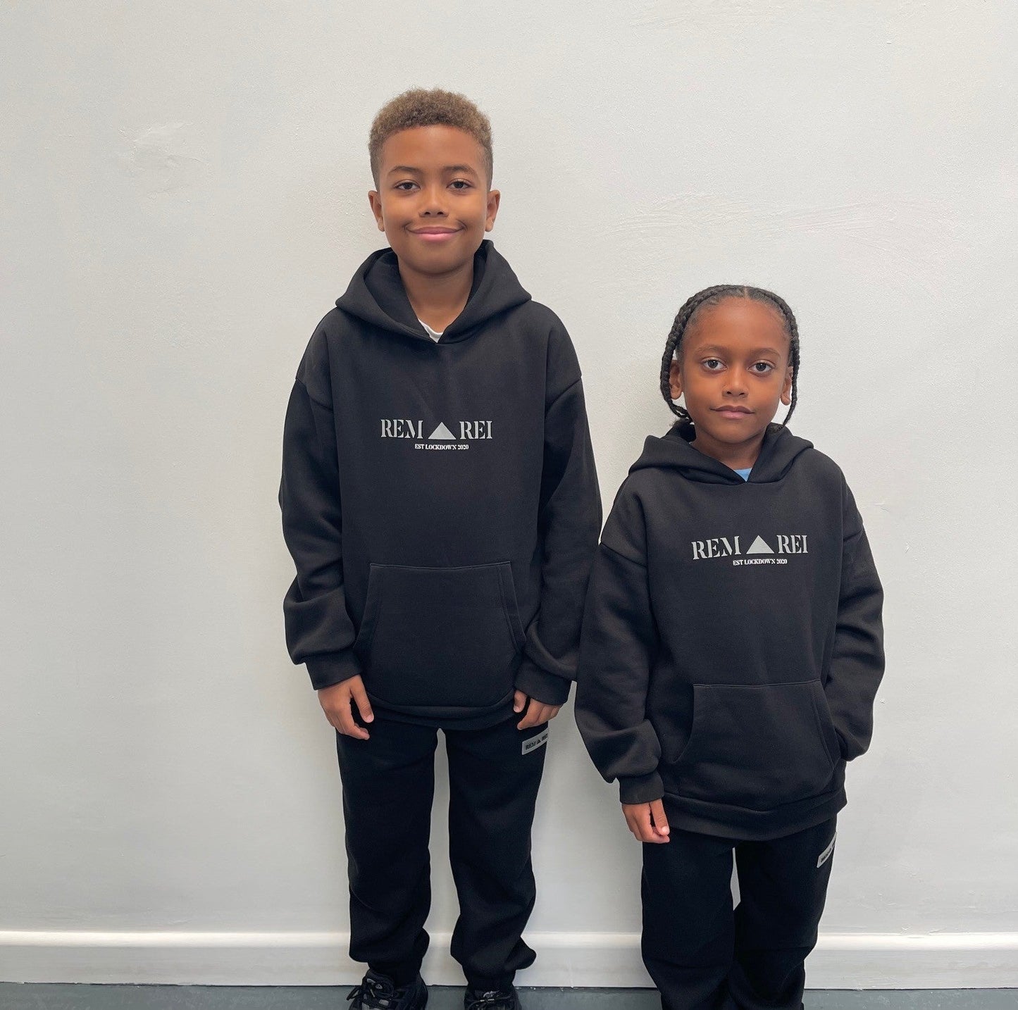 Boys designer black fleece lined hoodie. Stylish hoodie with reflective print on the front. made ethically. Boys, junior tracksuit set