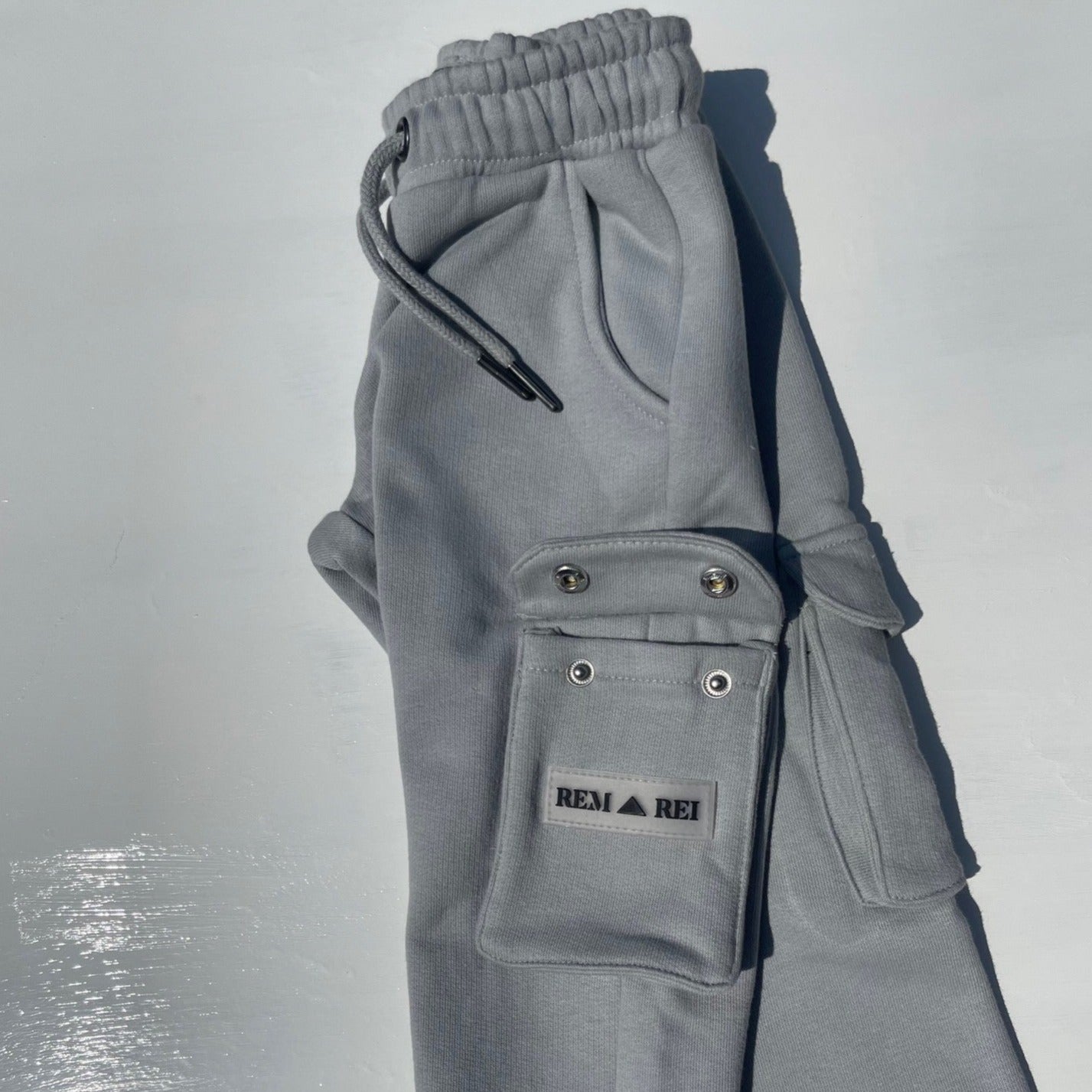 Close-up of utility pockets on Boys Grey Cargo Pants