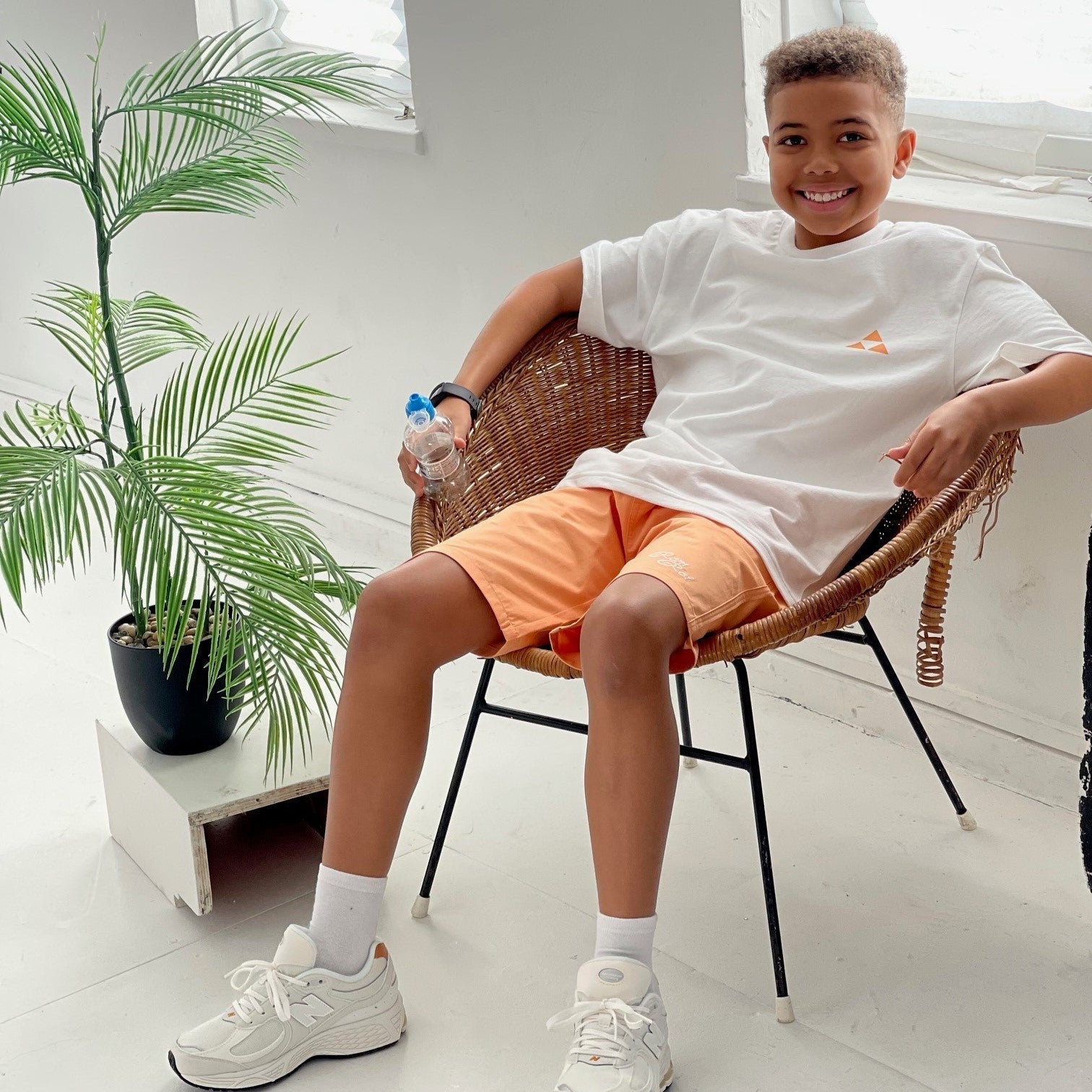 Boys bright orange shorts - holiday outfit - Rem & Rei