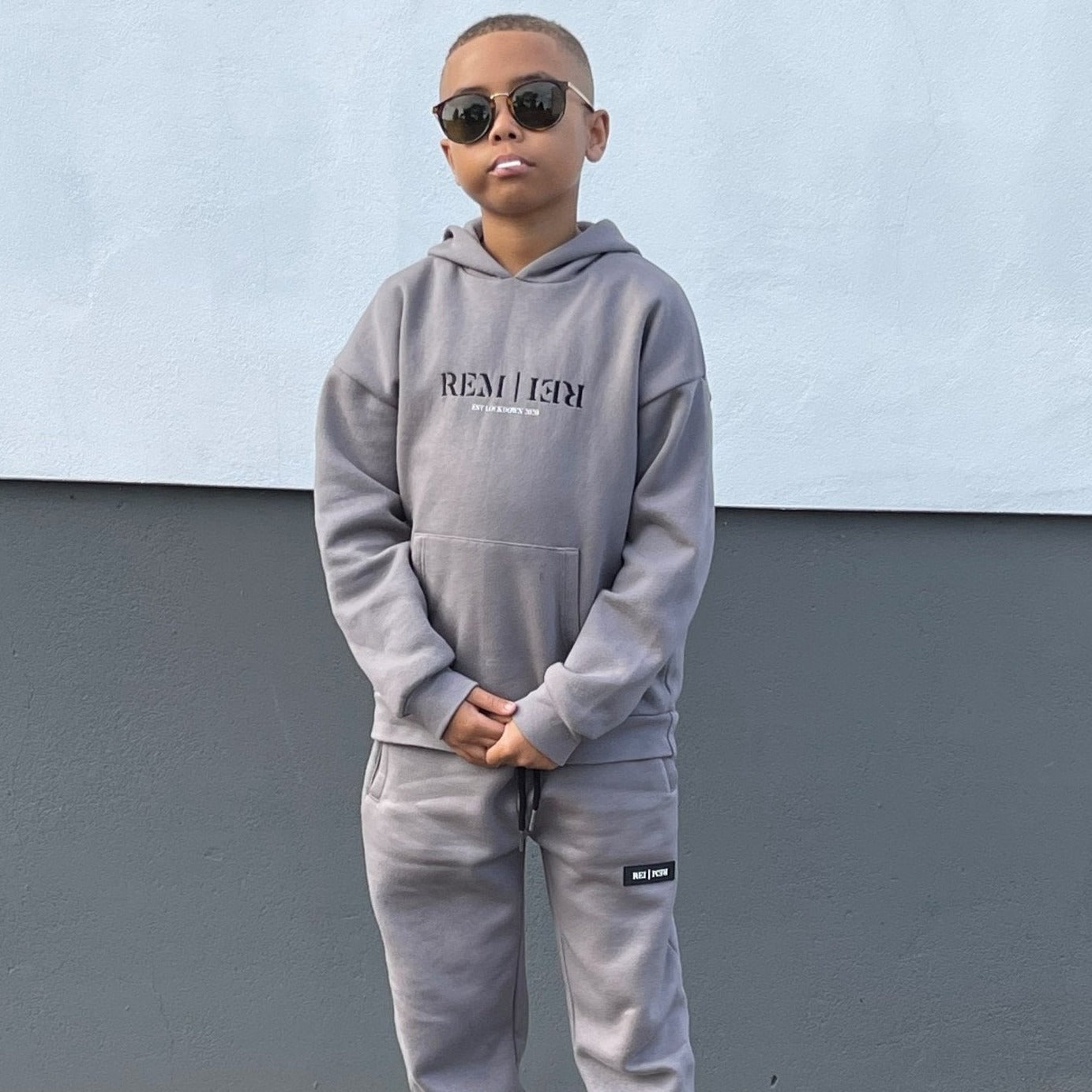 Boys designer grey fleece lined hoodie. Stylish hoodie with reflective print on the front. made ethically. Boys, junior tracksuit set